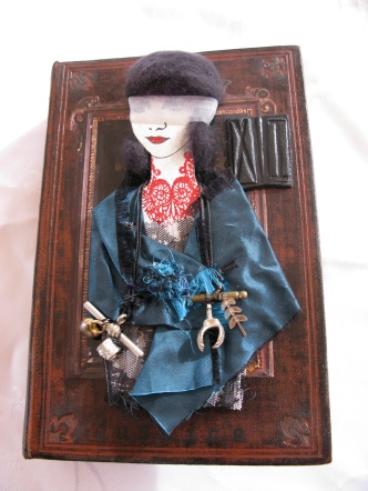 'Justice' Paper Doll on Book Cover. Silk, organza, thread, NZ wool, stamping, embossing, charms, air clay.